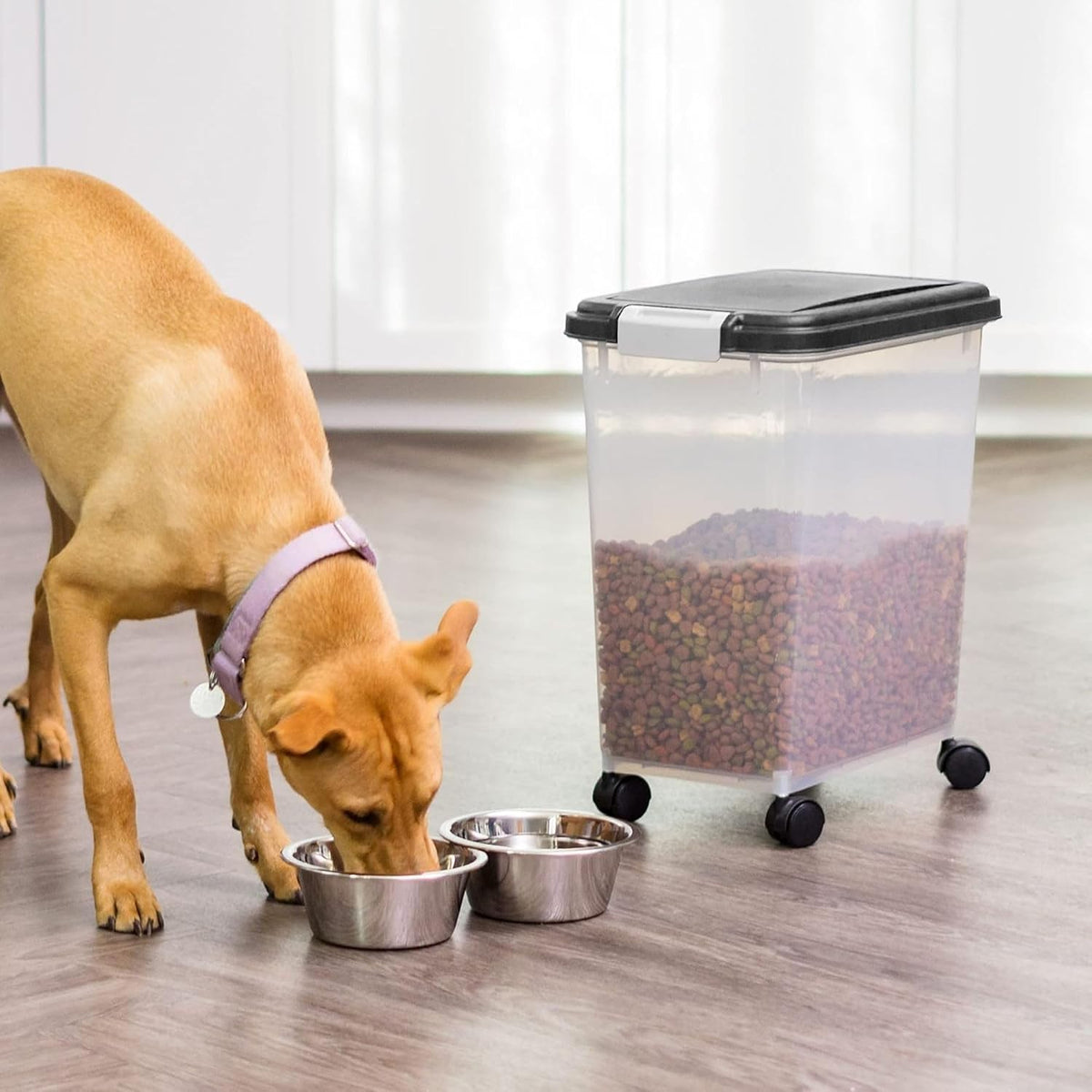 IRIS USA Airtight Pet Food Storage Rolling Container, 30 lb Capacity, Black | Airtight seal keeps kibble, bird seed, and pet food fresh while wheels provide easy mobility around the home.